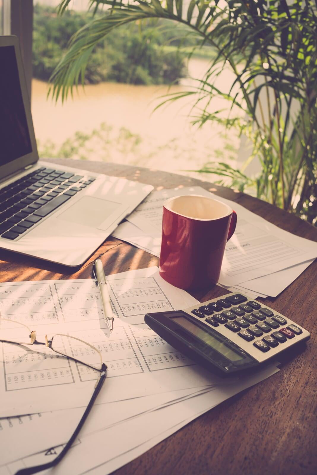 Calculator, Papers, Coffee Mug